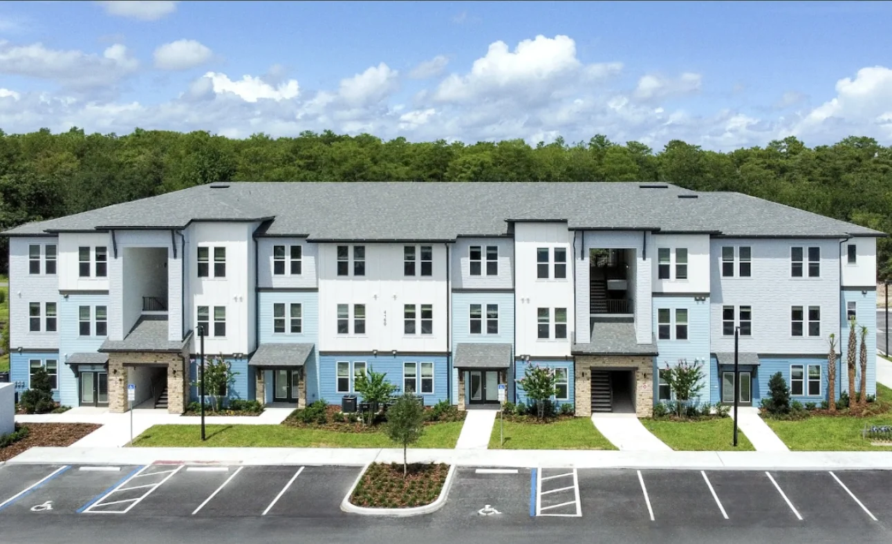 Finished blue and white apartment development exterior